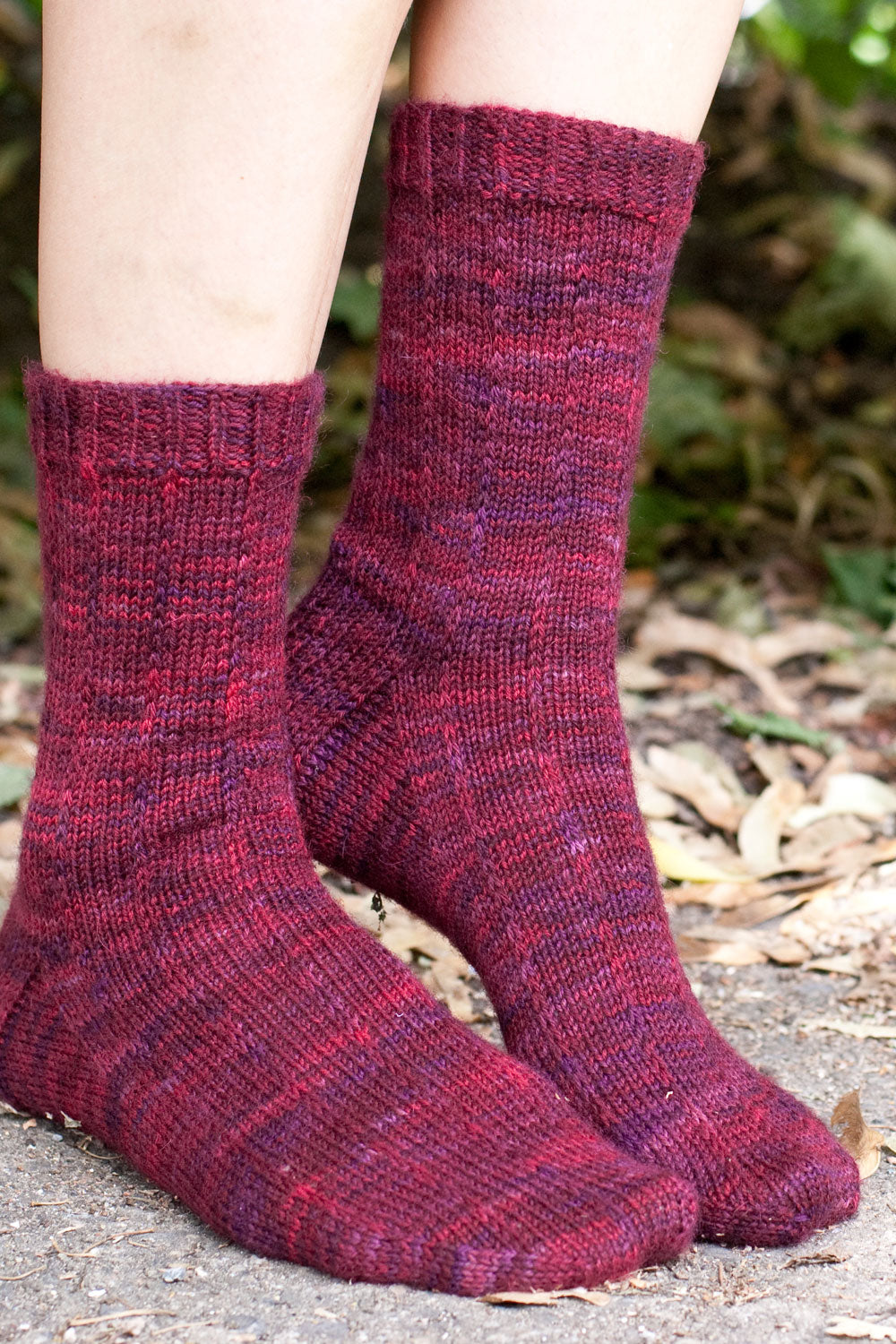 Socks knit with Pizzicato sock yarn in Palestra (purple/pink)