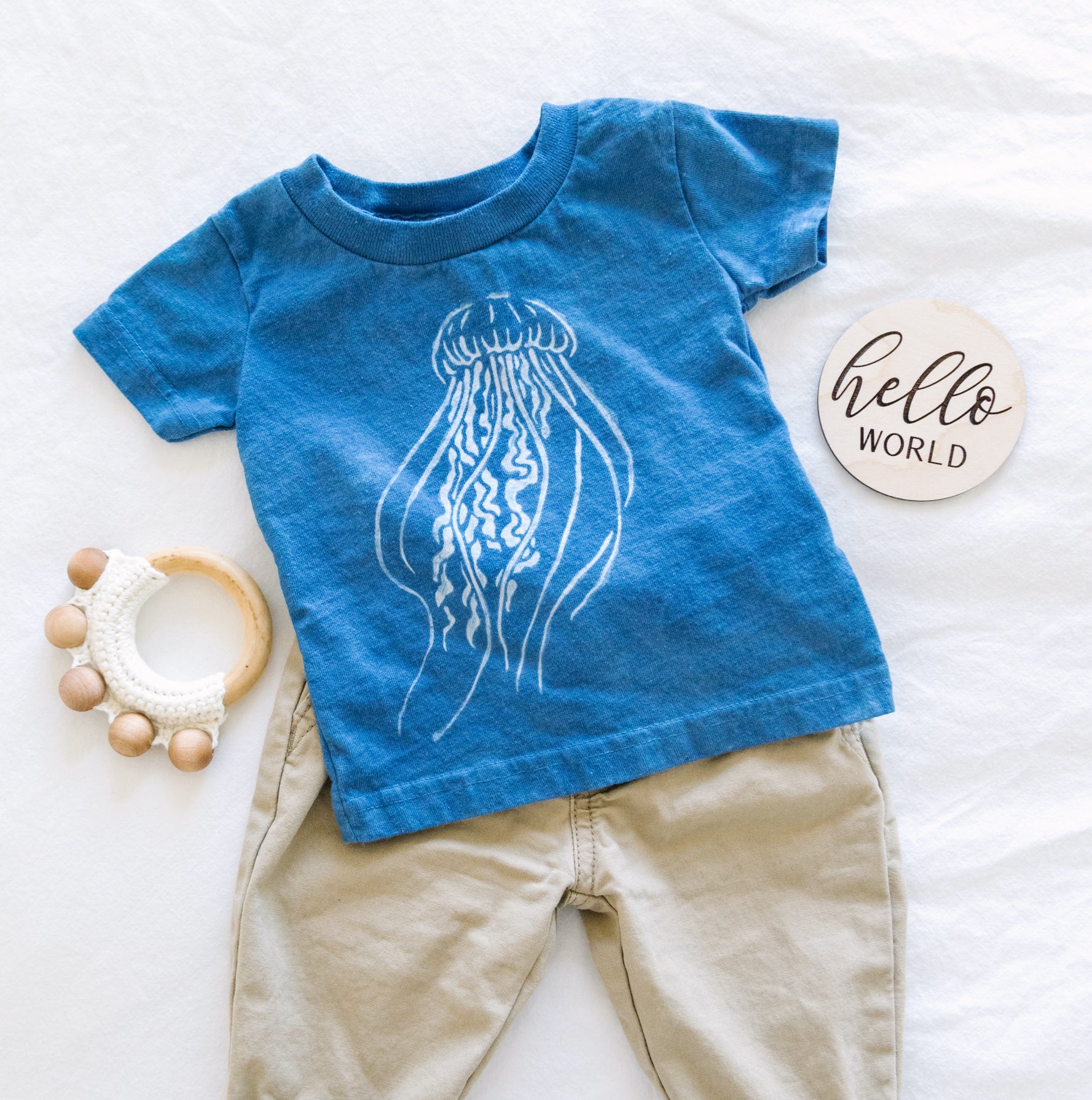 Example of tshirt dyed with clay resist: medium blue with white jellyfish motif