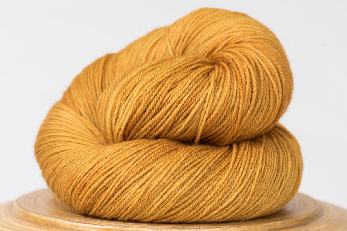 Harvest moon tonal gold fingering weight hand-dyed yarn