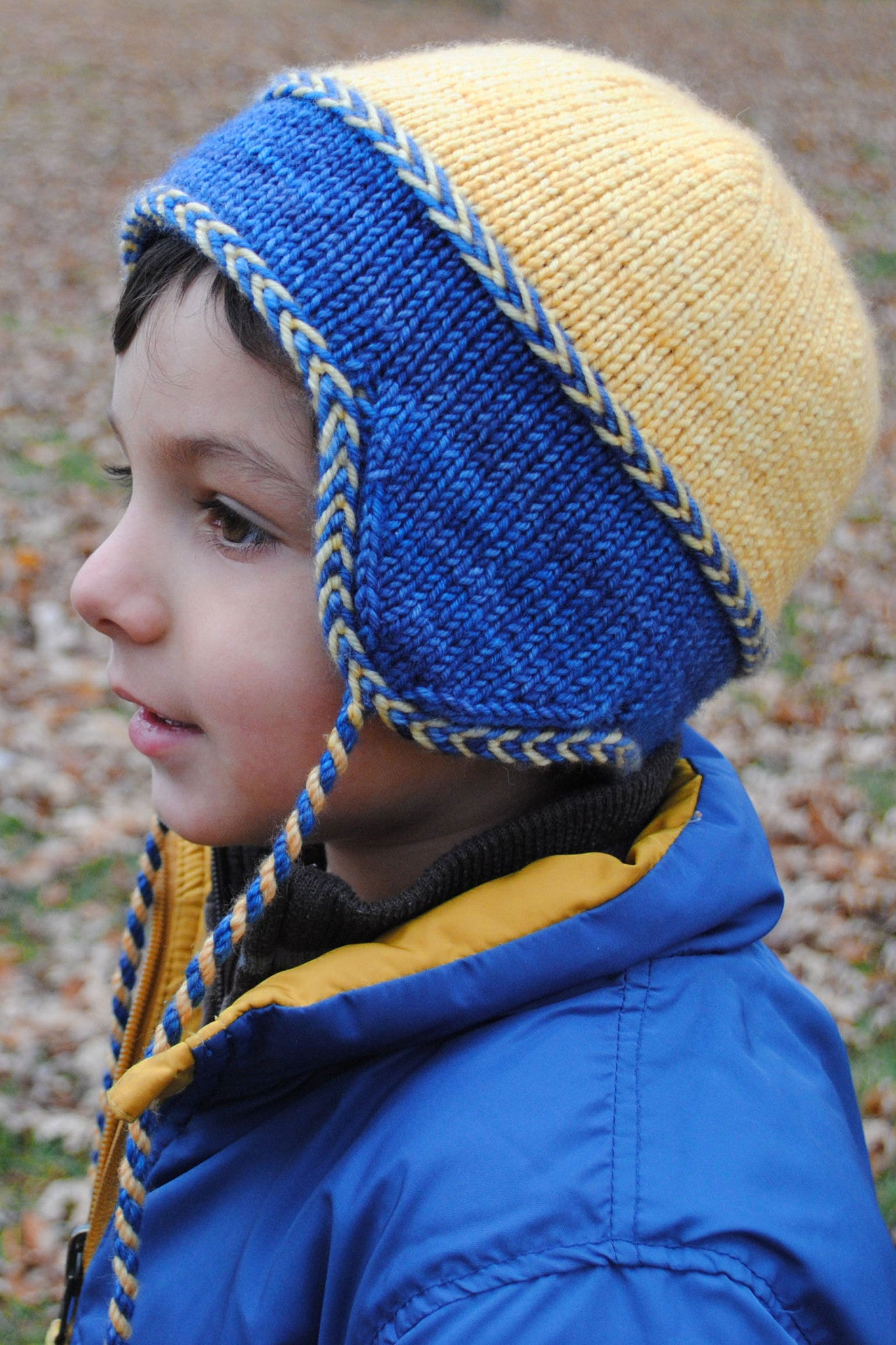 Little Leif reversible kids hat with Latvian braid